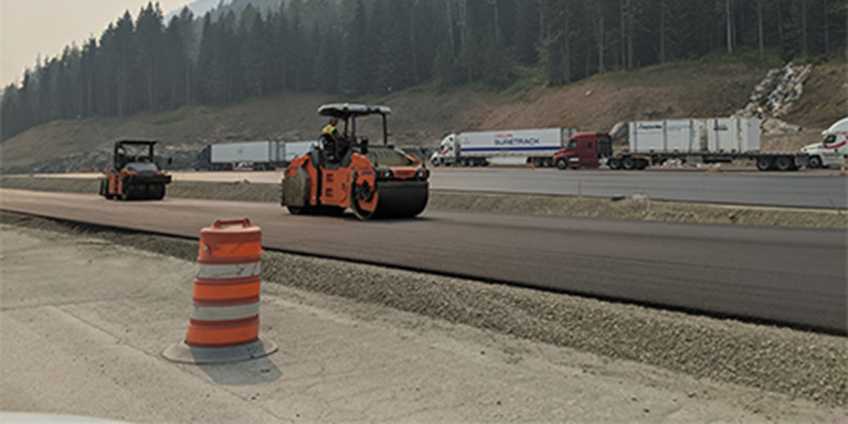 Construction workers building a highway.