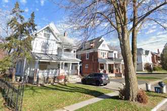 Large white brick house.