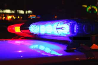 Red and blue lights on top of a police car.